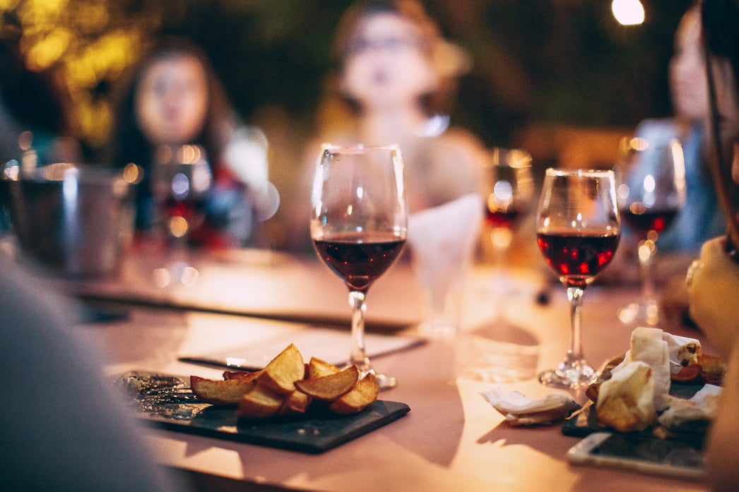 Clear Wine Glass With Red Wine on Table